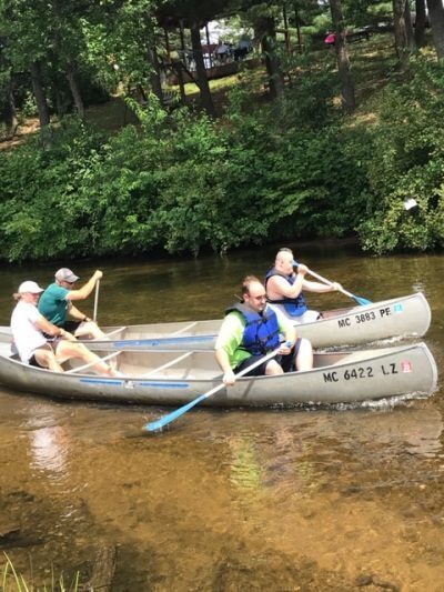 Students paddling down a river